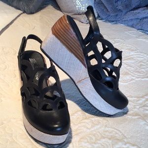 Black platform scalloped shoes